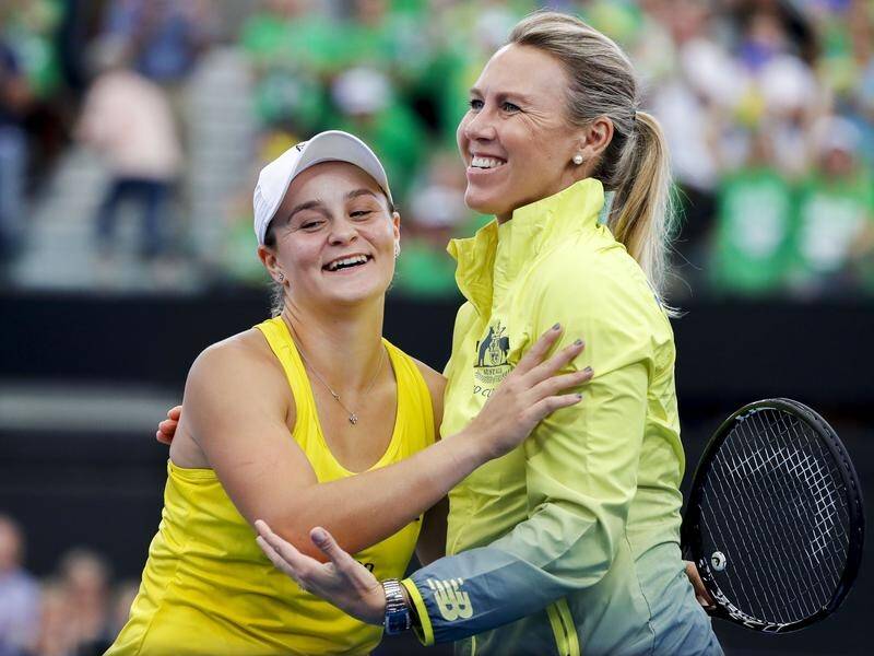 Coach Alicia Molik (R) has heaped praise on Ash Barty (L) after Australia's Fed Cup semi triumph.