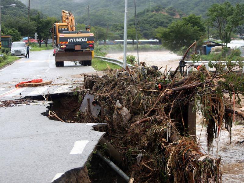 Heavy rains have pounded South Korea, leaving six people dead.