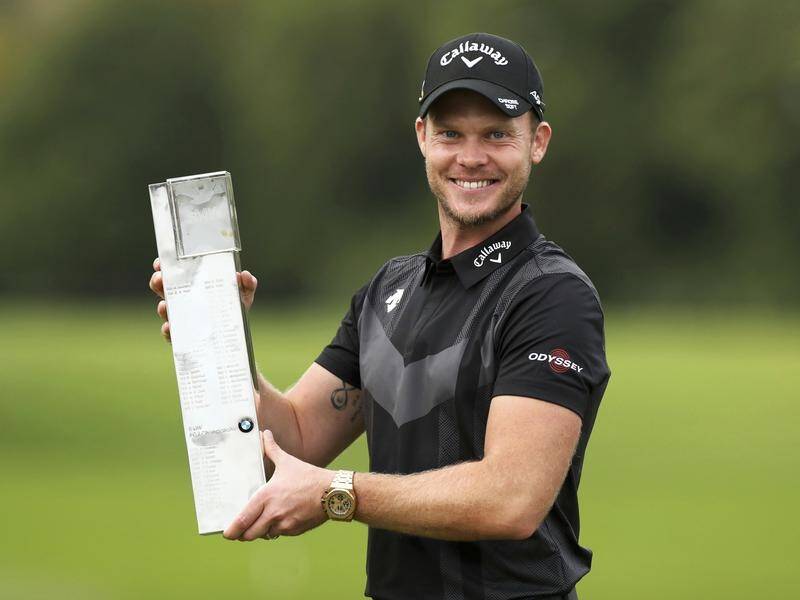 England's Danny Willett poses with the trophy after winning the PGA Championship at Wentworth.