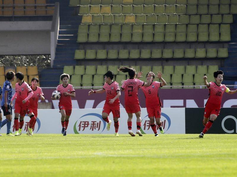 The Matildas' next Asian Cup opponents South Korea celebrate after their late equaliser vs Japan.