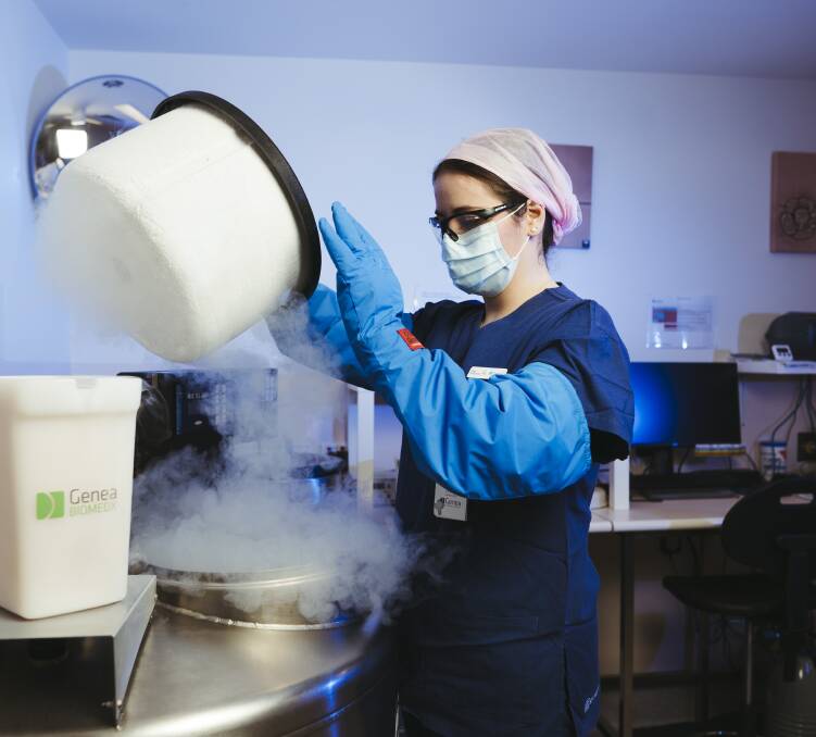 Embryologist Casidhe Goldsworthy with the tanks which store frozen embryos, eggs, and sperm. Picture: Dion Georgopoulos