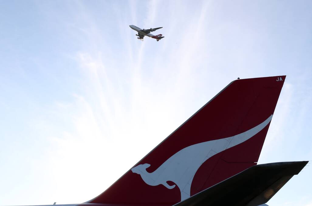 Goodbye and thanks for the memories: After this flyover at Albion Park Rail the last Boeing 747-400 in the Qantas 747-400 headed north-east over Shellharbour and off the coast of Newcastle painted a flying kangaroo formation in the sky as a parting gesture. Picture: Robert Peet. 