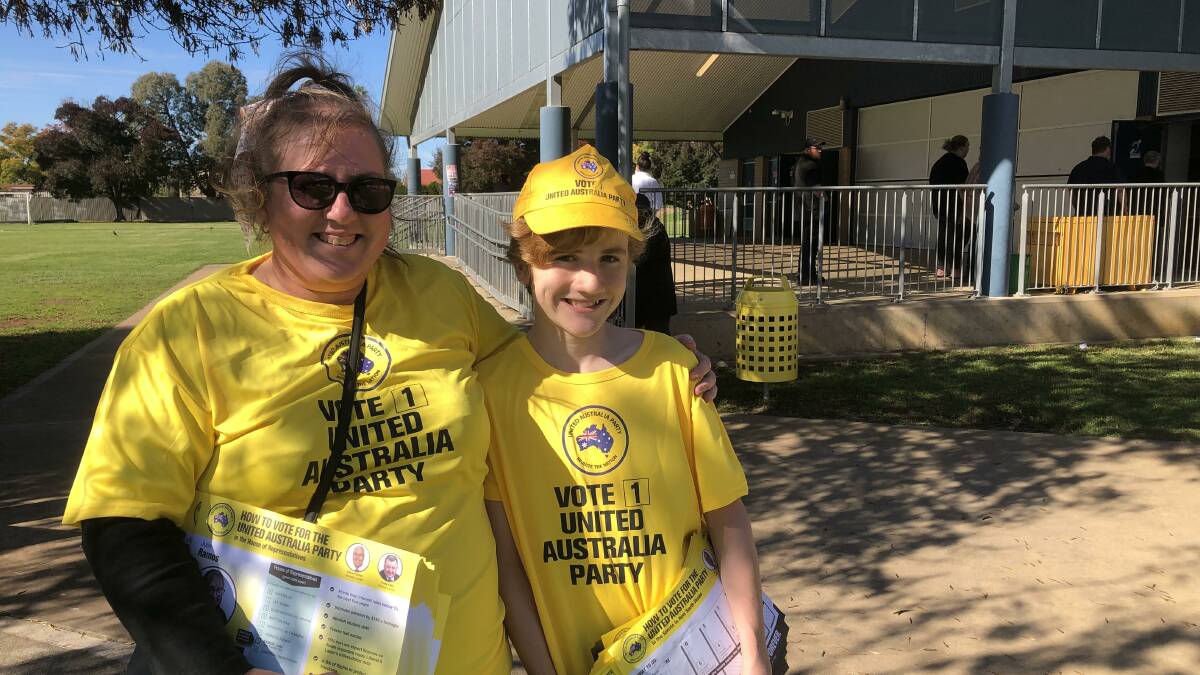 United Australia Party candidate Julie Ramos with her son Sebastian, 13, at Hanwood Public School on Saturday. PHOTO: Declan Rurenga