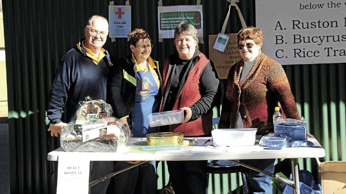 COMMUNITY MINDED: Coleambally-Darlington Point Country Education Fund members Terry Inglis, Sue Inglis, Penny Sheppard and Elaine Clarke man their stall at the Riverina Vintage Machinery weekend.